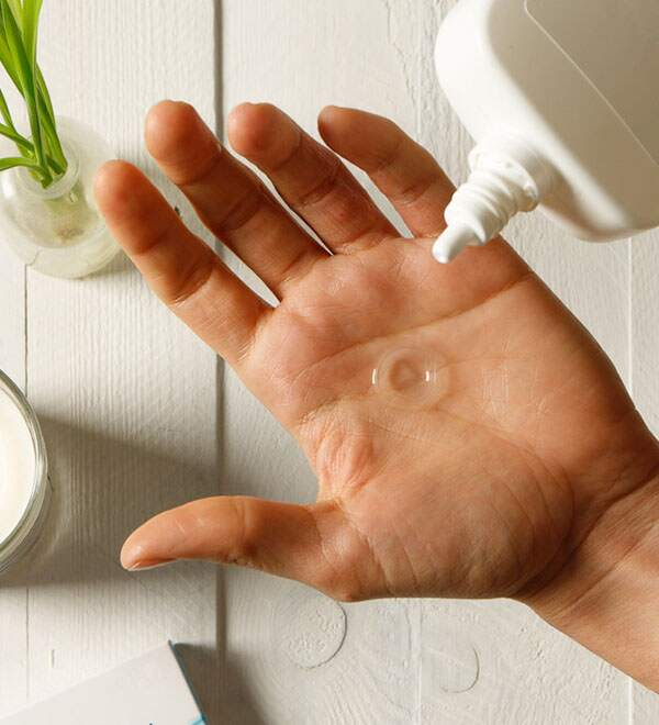 Image of contact lens placed in palm of hand